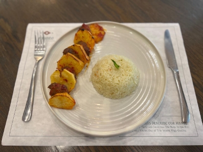 Picture of Meat and potato with tomato sauce and rice 