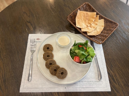 Picture of Falafel, tahini sauce, salad and pita bread