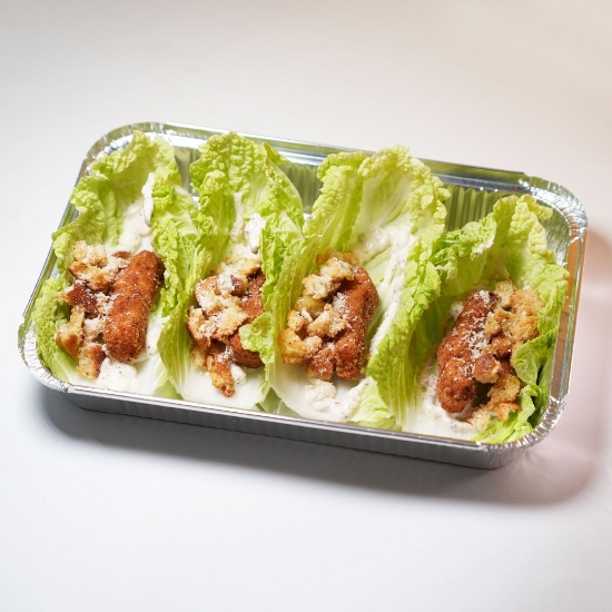 Picture of Caesar salad with fried chicken